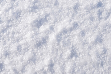 Close-up photo of snow and frost textures on frozen surface of the river. Winter background