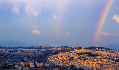 Double rainbow over Mount of Olives, with panoramic view from the Old city with Dome of the Rock on Temple Mount, Mount Scopus, the churches of Ascension to the arab villages in the Kidron valley