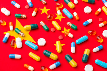 Capsules and tablets on flag of China. Medicine in China