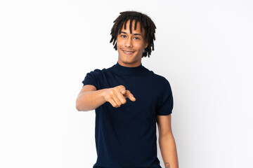 Young african american man isolated on white background points finger at you with a confident...