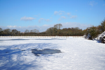 Fototapeta na wymiar Farm field covered in snow