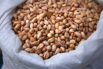 Nuts, pistachios in a bag on the counter in the bazaar