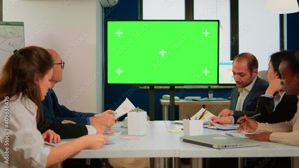 Poster group of business people discussing company plan with mockup tv green screen in front of desk, ready