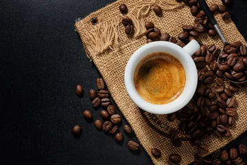 Fotobehang Koffie Steaming espresso served in cup on dark