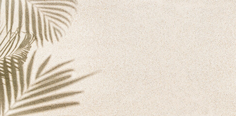Fototapeta na wymiar Banner of Palm leaf shadow on sand, top view, copy space