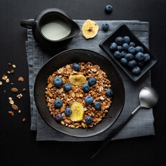 Muesli with berries and fruits in bowl