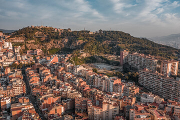 Obraz premium Aerial drone shot of park guell hill in Barcelona in morning