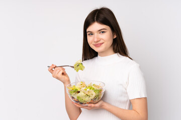 Young Ukrainian teenager girl holding a salad over isolated white background