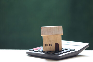 Estate tax, Model house on calculator green background, Business investment and Save money for...