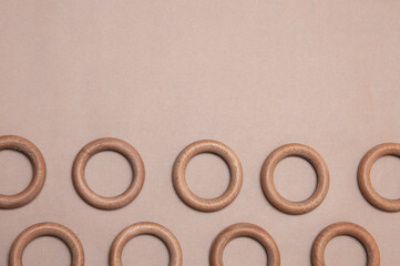 wooden rings laid out on a beige background
