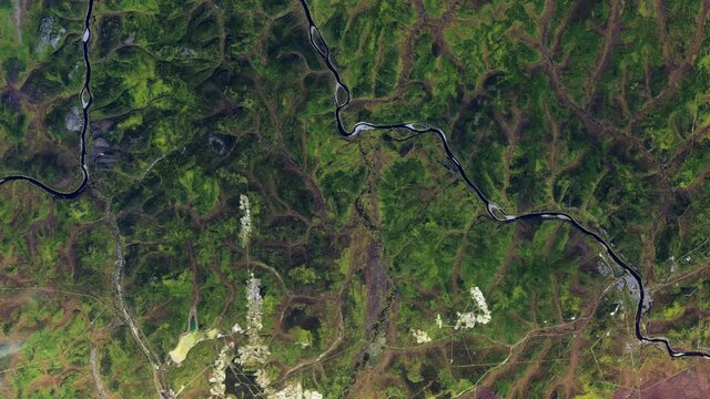 Open pit gold mine in Russia, aerial satellite view sunrise animation. Images furnished by Nasa
