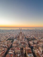 Fototapeta na wymiar Aerial drone shot of Barcelona city before sunrise golden hour