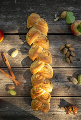 homemade bread with apples and nuts in the shape of an ear