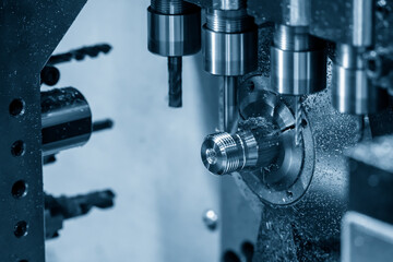 The  operation of multi-tasking CNC lathe machine cutting the fitting part. The hi-technology pipe connector parts by CNC turning machine.