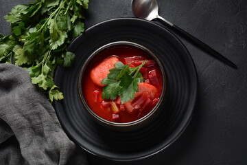Hot red beet Kubbeh soup, a famous middle eastern dumplings soup dish, served in a bowl. A Jewish-Iraqi traditional matfuniya winter soup. Levantine dish made of bulgur, minced onions, ground  beef