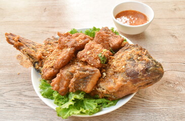 batter fried slice mango or red Tilapia fish with chop garlic dipping spicy sauce