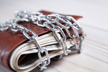 lock on the wallet with money on the table