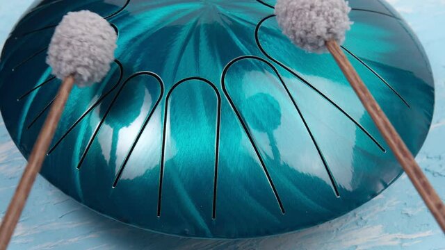 hang musical instrument, glucophone. metal tongue drum, modern musical instrument.
