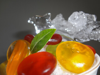 Fresh fruits background.Slices of fresh fruits top view on ice.