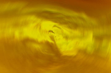 Abstract background of swirling spheres golden yellow tones.