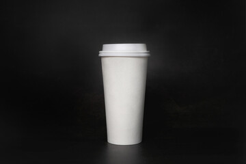 Coffee paper cup on Black background for takeaway.