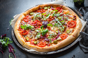 pizza vegetables tomato, onion, pickles, mushrooms, etc. vegan or vegetarian food ready to eat portion on the table for healthy meal snack outdoor top view copy space food background rustic 