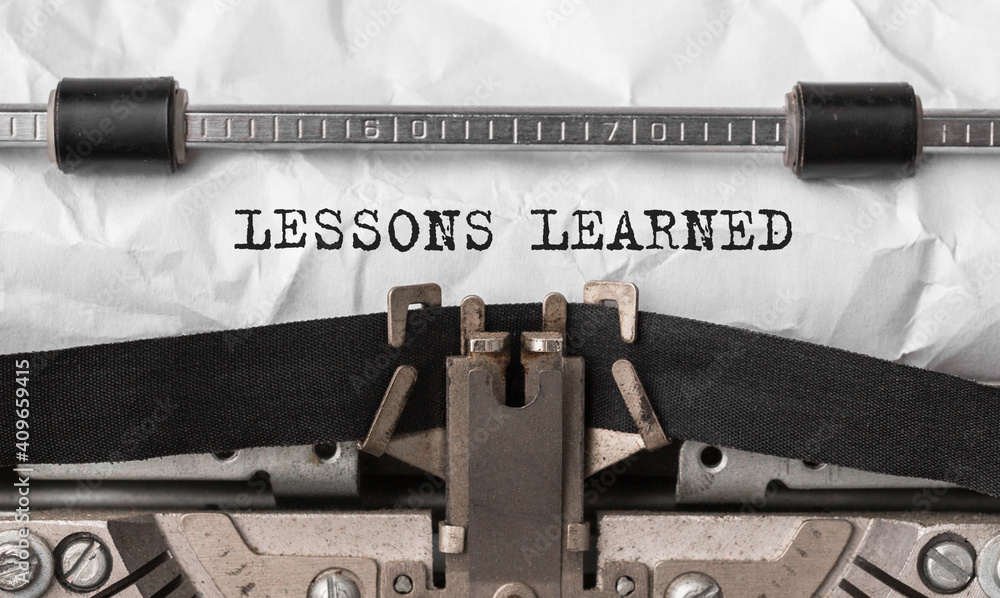 Poster text lessons learned typed on retro typewriter