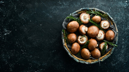 Mushrooms. royal champignon mushrooms in a wooden box. Rustic style. Top view.