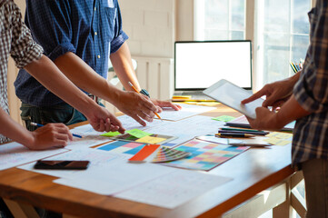 Designer teams brainstorm ideas to discuss website and mobile app designs.