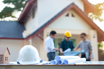 Engineers and contractors consult together to plan the construction project. Architect and design concept, plan construction.