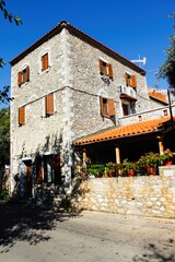 Exterior view of house at the traditional village of Kardamyli in Messiniaki Mani region, southwestern Peloponnese, Greece.