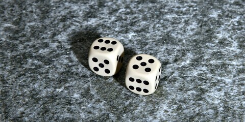 A pair of white dice thrown with the number eleven isolated on a white background