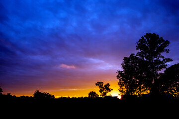 Fototapeta na wymiar Beautiful sunset over the sky shiny vivid colors, motion blur background - Copy