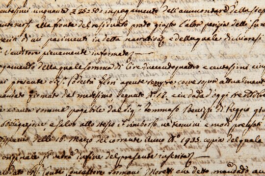 Ancient manuscript of 1700 century written in ink and goose pen in Italian. Antique letter with handwritten text. Stained texture background. Vintage style toned picture 
