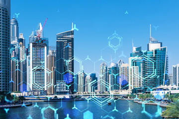 Skyscrapers of Dubai business downtown. International hub of trading and financial services. Technology theme icons hologram, concept of big data. Double exposure. Dubai Canal waterfront.