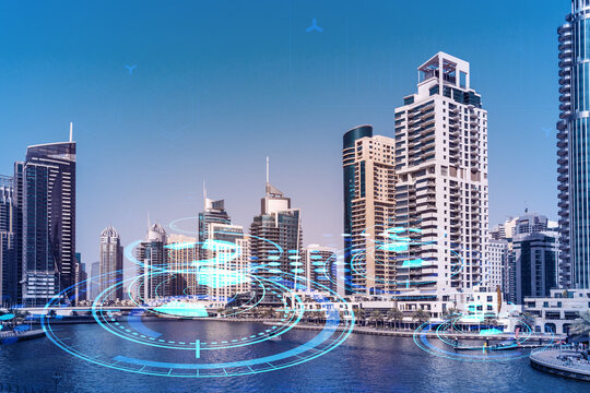Skyscrapers of Dubai business downtown. International hub of trading and financial services. Technology theme icons hologram, concept of big data. Double exposure. Dubai Canal waterfront.