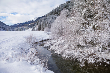 wintry river in the alps