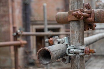 Rusty scaffolding in old church ruins.
