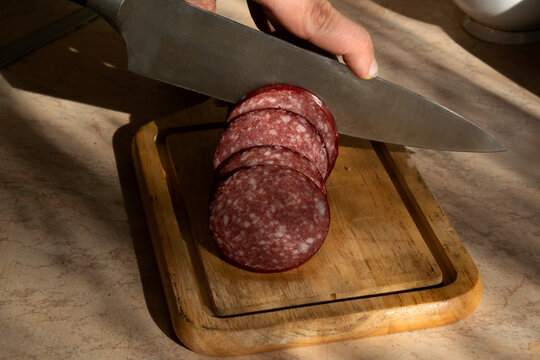 Sliced ​​kalbasa on a board.

