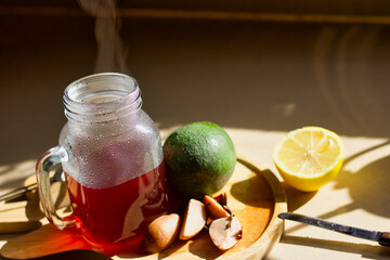 Avocado Tea with fruit and nut on wooden top