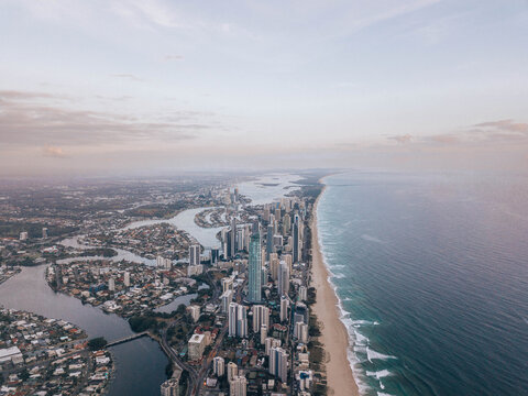 Aerial view of city buildings near body of water