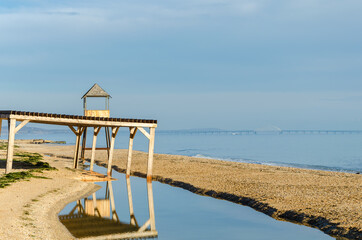 A sandy beach washed away by a storm.