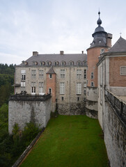 Modave Castle, Belgium. View of side fortifications and wall.