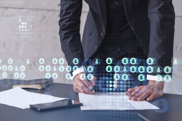 A potential employee in formal suit signing the contract to boost his career and gain new opportunities in personal growth. Concept of success. Hiring a new talented crew. Social media hologram icons