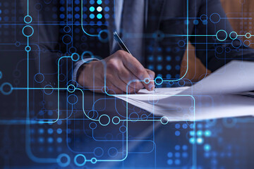 A client in dark blue suit is signing a contract to create a new software to present it in start up...