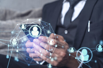 Hands of hr specialist browsing social networks in the Internet in smart phone to find the best candidates to hire international team. Concept of success. Media hologram icons. Formal wear.