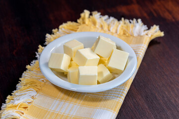  fresh butter, accompaniment, oil, kitchen, pasteurized, cook, gastronomy, knife, wooden, portion, cuisine, gourmet, dairy, food, ingredient, butter, cut, breakfast, background, fresh, spread, product