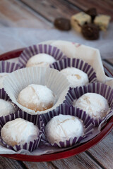 Greek Christmas cookies kourabiedes with almonds powered with white sugar