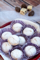 Greek Christmas cookies kourabiedes with almonds powered with white sugar