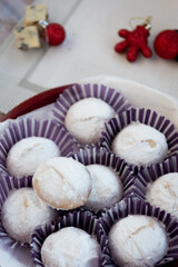 Greek Christmas cookies kourabiedes with almonds powered with white sugar